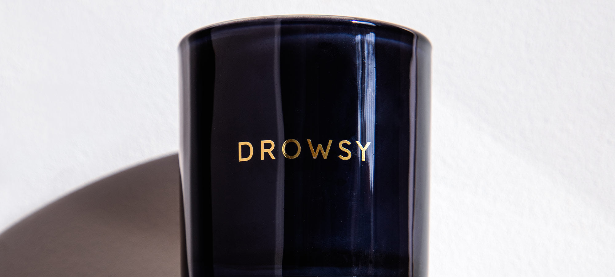 Drowsy-Sleep-Co.-Sleep-Candle-Blue-Glass-Close-up-Wide.jpg__PID:e03ddfc7-bdb4-4971-a01e-a6d905d951c5